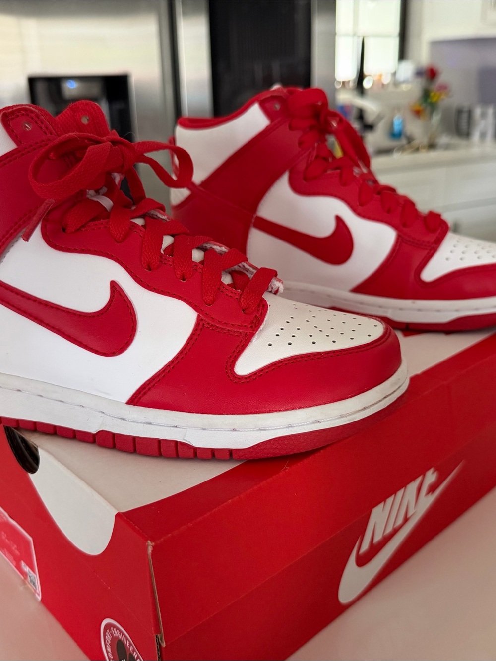 Nike Kids Red and White High-Top Jordan 1’s.